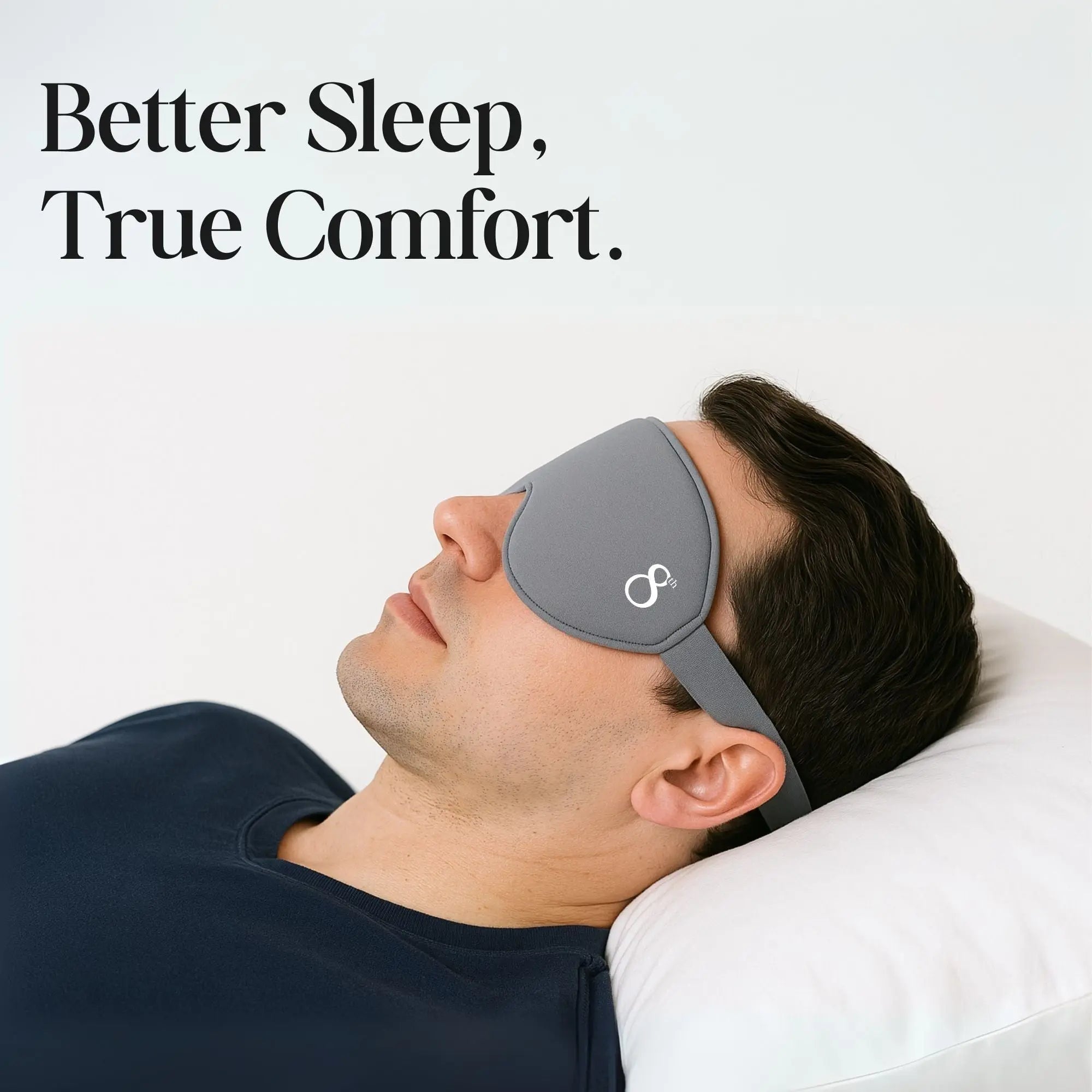 The 8th branded high quality sleeping mask in gray worn by man resting on white pillow