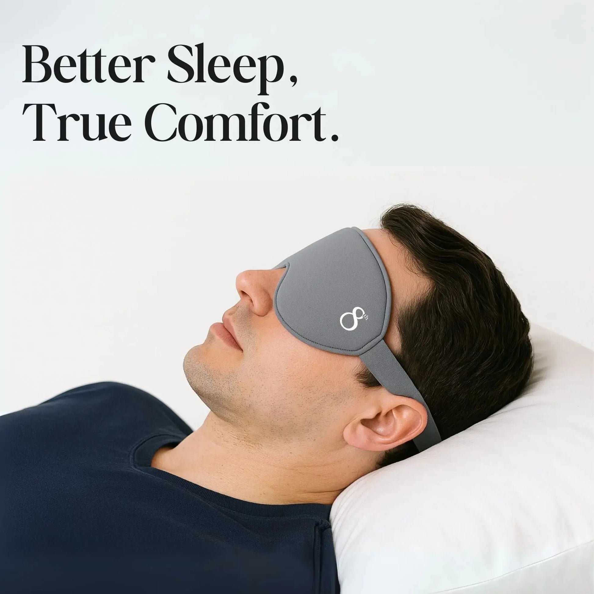 The 8th branded high quality sleeping mask in gray worn by man resting on white pillow